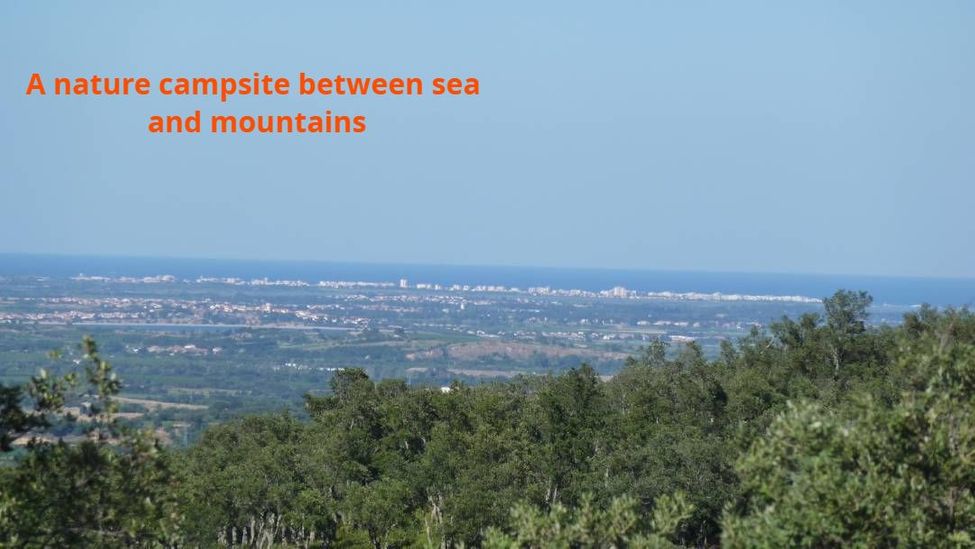 A nature campsite between sea and mountains